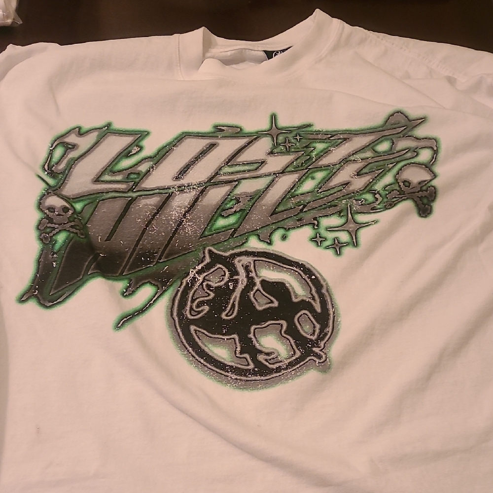 White Graphic Tee with Green and Black Design